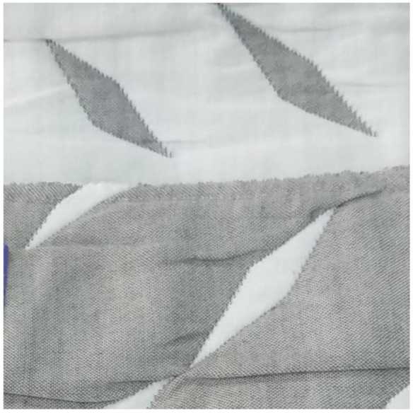 detalle colcha suances gris