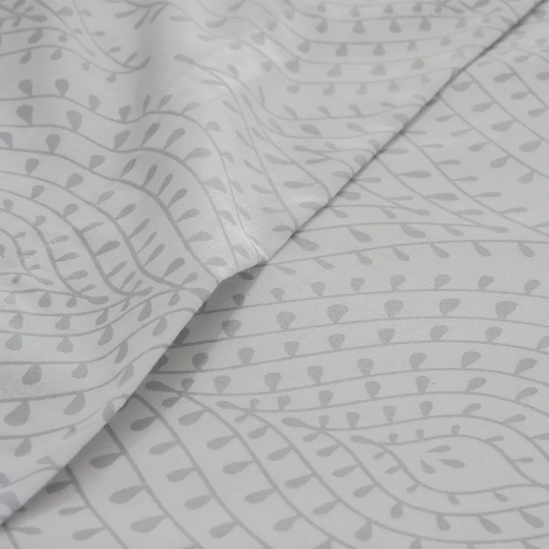 detalle del juego de sábanas gris algodón poliéster con funda nórdica