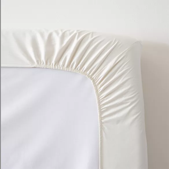 sábana bajera ajustable beige cuatro puntos de ajuste